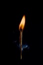 Safety match on black background with flaming head Royalty Free Stock Photo