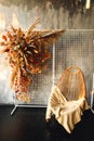 Vertical photo of modern interior with wicker chair and pampass grass Royalty Free Stock Photo