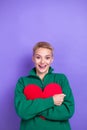 Vertical photo of overjoyed shocked blonde short hair lady green zipper jacket hugs valentine day gift unexpected