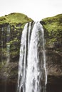 Seljalandsfoss waterfall, Gljufrabui Iceland - vertical drone photo