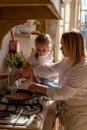 Vertical photo of the process of making pancakes in the home kitchen Royalty Free Stock Photo