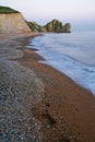 Vertical photo of Purbeck Heritage Coast in England shot during early peaceful morning