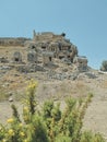 vertical photo of ruins of ancient city of Tlos, the acropolis against the blue sky. soft focus Royalty Free Stock Photo