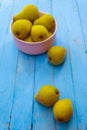 Ripe pears from the city garden lie on a wooden table and in a plate Royalty Free Stock Photo