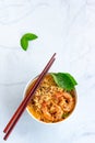 Vertical Photo of Shrimp Noodle Bowl with Chopsticks on White Background