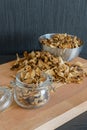 Vertical photo of sliced and dried various mushrooms in three pr