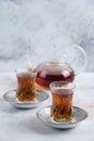 Vertical photo. Teapot and glass two glass tea on white background Royalty Free Stock Photo