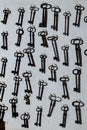 Vertical photo of the texture of old keys. Keys to the gate, tower, castle. Wall of ancient metal keys Royalty Free Stock Photo