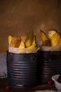 Fried potato stripps on wooden board in old cans Royalty Free Stock Photo