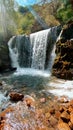 A vertical photo of waterfall in nature Royalty Free Stock Photo