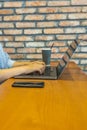 Vertical photo of woman hand typing laptop keyboard on table Royalty Free Stock Photo