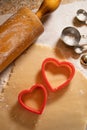 Heart Shaped Cookie Cutters with Cookie Dough and Baking Items Royalty Free Stock Photo