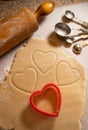 Heart Shaped Cookie Cutters with Cookie Dough and Baking Items Royalty Free Stock Photo