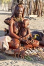 Himba mom with her baby in her arms. Namibia