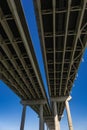 View Underneath a Large Bridge Highway on a Sunny Day with Blue Sky