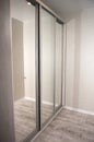 Vertical picture of big gray wardrobe with glass doors Royalty Free Stock Photo