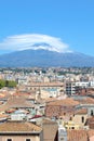 Vertical picture capturing famous Mount Etna overlooking the Sicilian city Catania, Italy. Smoke cloud over the famous volcano Royalty Free Stock Photo