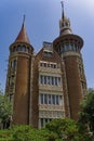 Vertical picture of the Casa Terradas surrounded by trees under the sunlight in Spain