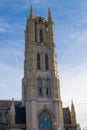 Vertical picture of the facade of Saint Bavo Cathedral Sint-Baafskathedraal in Sint-Baafsplein in Ghent, Belgium, during a sunny