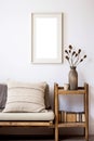 Vertical picture frame with passe-partout mockup in living room interior, blank copyspace, light tones, wall art mock-up.