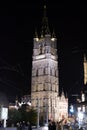 Vertical picture of the illuminated facade of the Belfry Het Belfort of Ghent taken from Emile Braunplein, in Belgium, Europe,