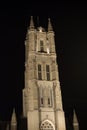 Vertical picture of the illuminated tower of Saint Bavo Cathedral Sint-Baafskathedraal in Sint-Baafsplein in Ghent, Belgium,