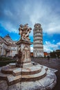 Vertical picture of the Leaning Tower of Pisa under a cloudy sky at daytime in Italy