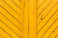 Obsolete yellow painted wooden background texture. Outdoor, macro