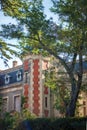 Vertical picture of old stone chateau, vineyard in french, in Chateauneuf-du-Pape, famous wine province in Provence, France.