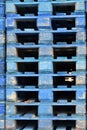 Stacks of wooden cargo shipping pallets.