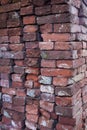 Vertical of a pile of old bricks in various colors Royalty Free Stock Photo