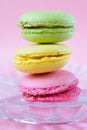 Vertical pile of three colorful french cookies made of almond flour called macarons Royalty Free Stock Photo