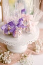 Vertical of pink and purple birthday cake pops on a dessert table. Royalty Free Stock Photo