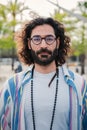 Vertical portrait of adult young man looking at camera with serious and confident expression on his face, wearing casual Royalty Free Stock Photo