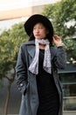 Vertical portrait of a classy asian woman in hat Royalty Free Stock Photo