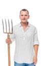 Vertical portrait of a farmer with forks in his hand on a white