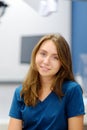 Vertical portrait of female ENT doctor during appointment of patient in medical office. Professional otolaryngologist is on Royalty Free Stock Photo