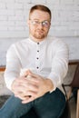 Vertical portrait of handsome confident young business man in elegance eyeglasses wearing stylish white clothes looking Royalty Free Stock Photo