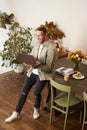 Vertical portrait of handsome happy man, manager or CEO of company, sitting on table and holding laptop, laughing, video Royalty Free Stock Photo