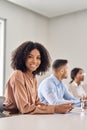 Vertical portrait of happy young African business woman at office meeting. Royalty Free Stock Photo