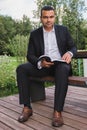 Vertical portrait of a male businessman of Middle Eastern appearance in a business suit