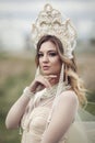 Vertical portrait of a Russian girl in kokoshnik