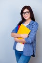 Vertical portrait of smart young girl in glasses and checkered s Royalty Free Stock Photo