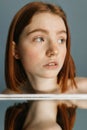 Woman looking away while sitting at the table