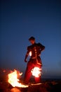 Male performer juggling fire