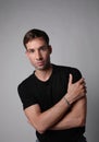 Vertical portrait of young man with serious face expression. White background. Royalty Free Stock Photo