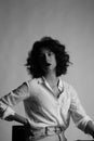 Vertical portrait of young woman, posing in the studio. Black and white. Royalty Free Stock Photo