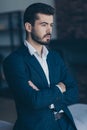 Vertical profile photo of handsome business person guy crossing hands in modern stylish interior apartments office