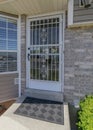 Vertical Puffy clouds at sunset Entrance of a house with glass front door with grills