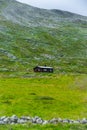 Vertical realistic view of a single house on a mountain in summer Norway Royalty Free Stock Photo